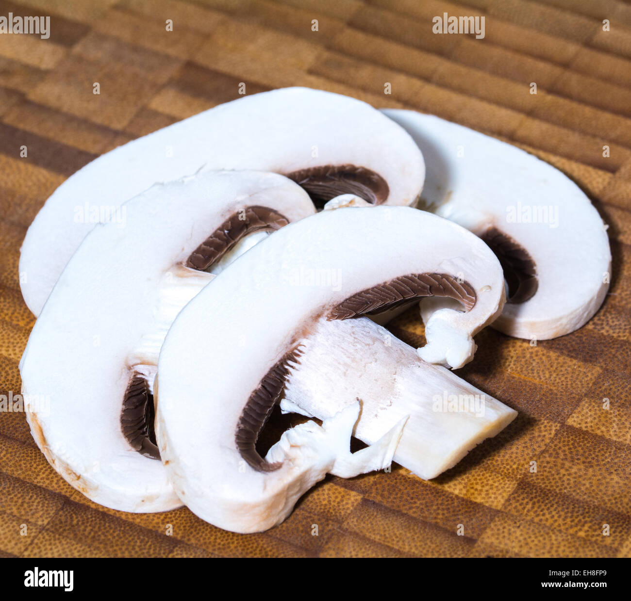 Sliced mushrooms on a cooking board Stock Photo