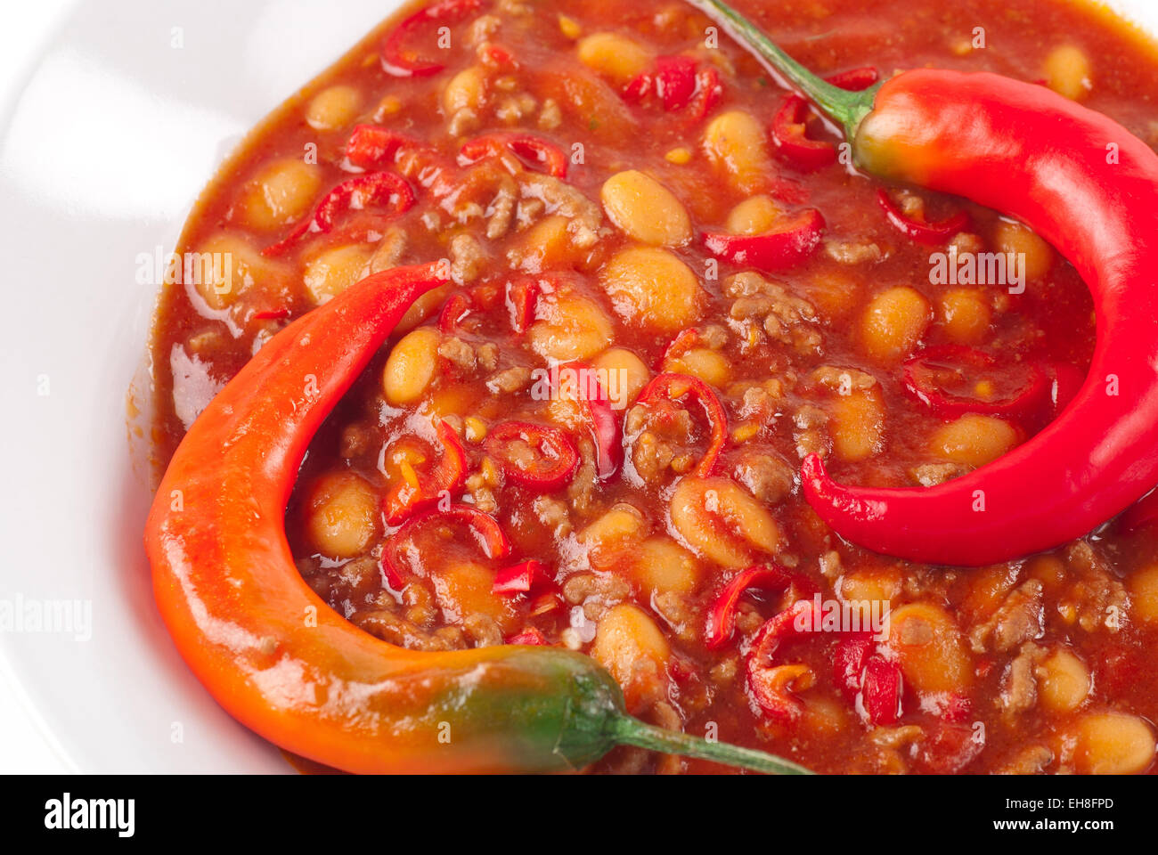 Spicy chili with fresh chili pepper. Stock Photo