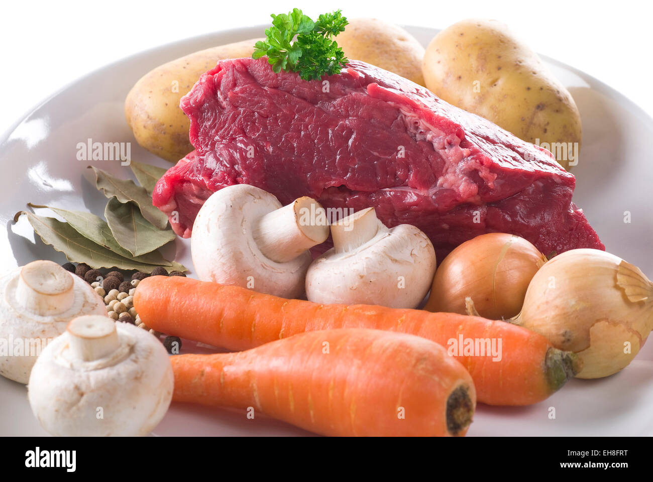 Fresh beef stew ingredients on a plate. Stock Photo