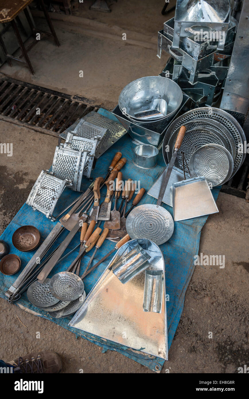 A tin goods shop proudly displaying it's wares outside the workshop in Shimla, Himachal Pradesh, India Stock Photo