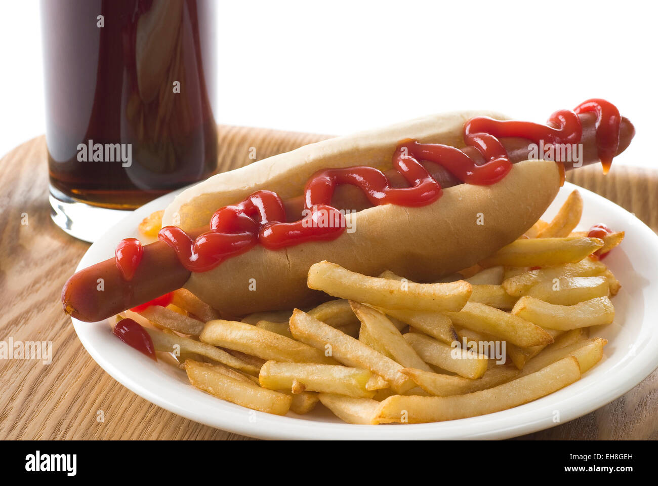 Sausage with bread, ketchup and french fries. Stock Photo