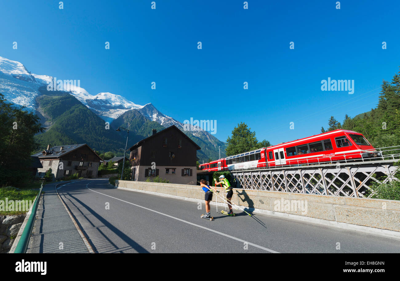 Europe, France, Haute Savoie, Rhone Alps, Chamonix Valley, Mont Blanc Express train and roller skiers Stock Photo