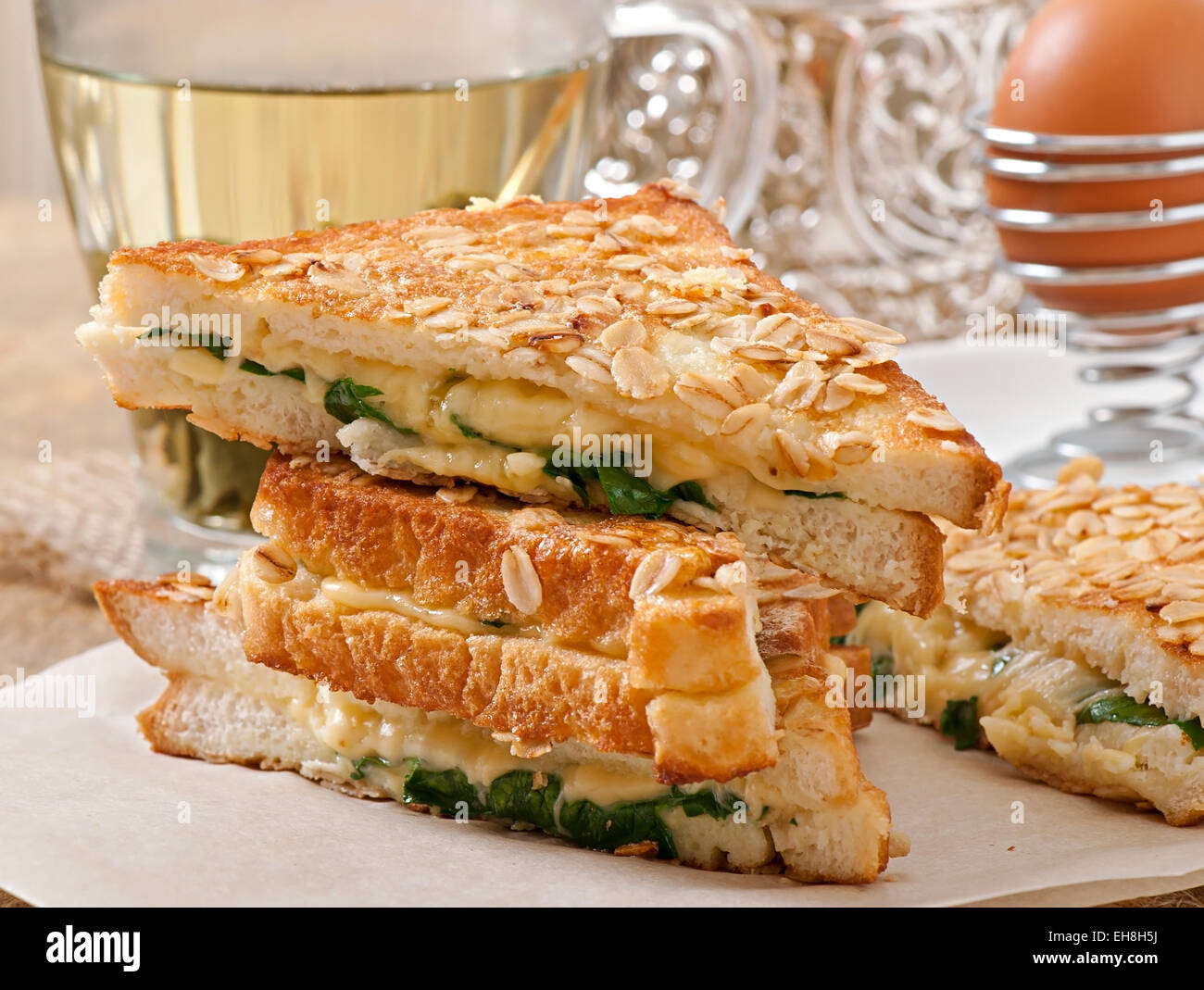 Warm toast with cheese and spinach for breakfast Stock Photo Alamy