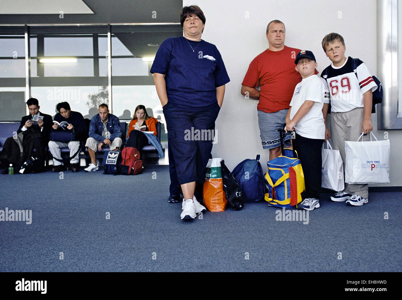 uk holiday makers wait for announcement about their delayed flight Stock Photo