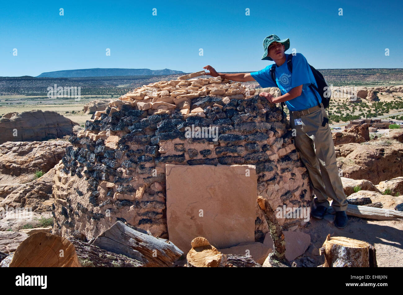 Local guide at horno, adobe-built outdoor oven at Acoma Pueblo (Sky City), New Mexico, USA Stock Photo