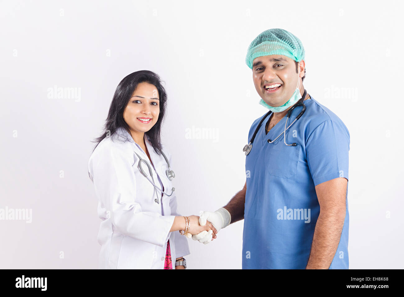 Indian woman doctor shaking hand hi-res stock photography and images ...