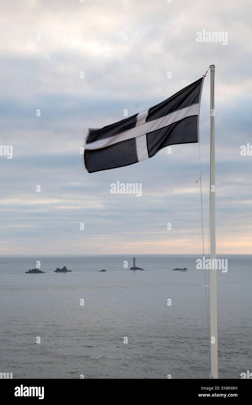 Cornish Flag; Dusk; Longships Lighthouse Cornwall; UK Stock Photo