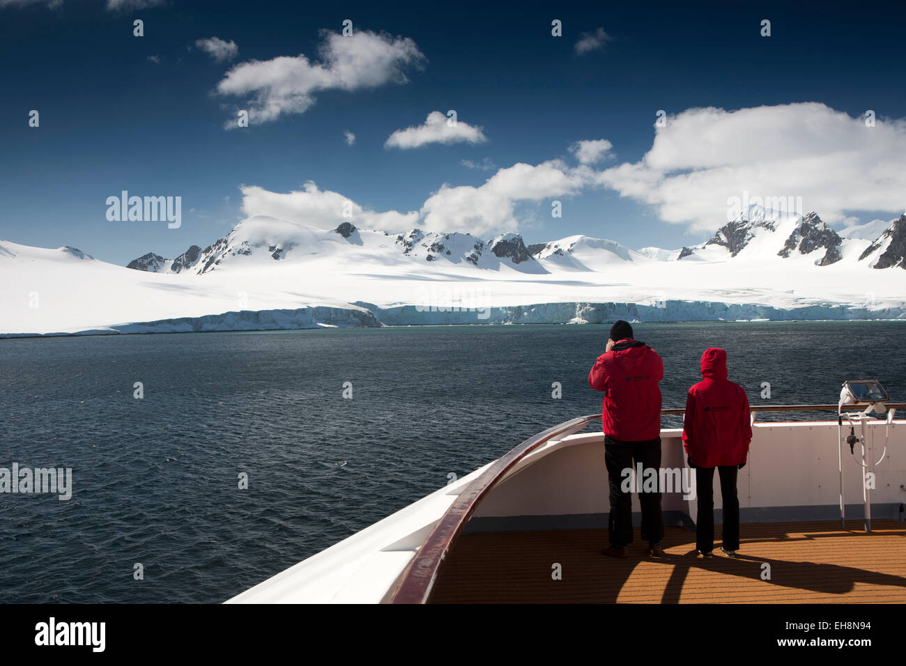South Orkney Islands, Laurie Island, cruise ship passengers viewing snow capped coastal mountains Stock Photo