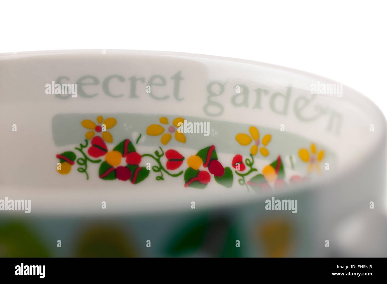 Secret garden inscribed on the inside of a Bone China Queens Julie Dodsworth mug Stock Photo