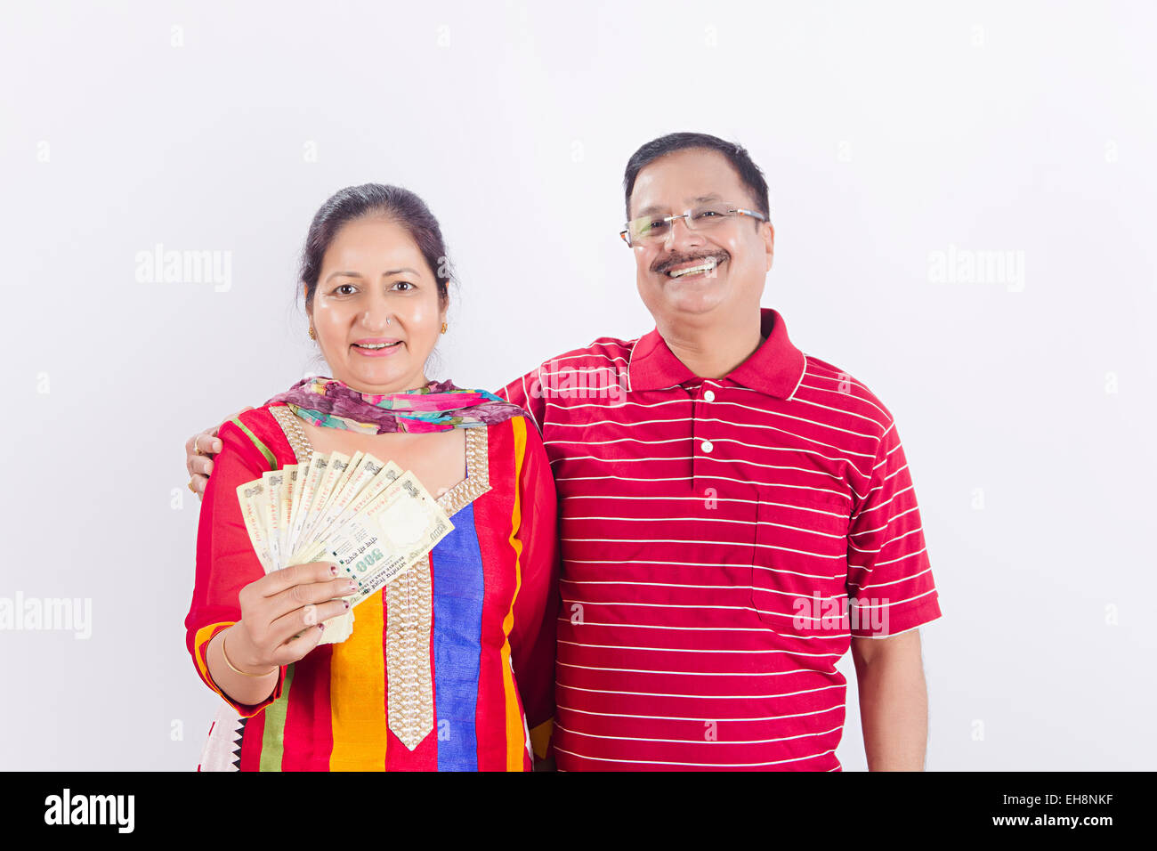 2 indian Seniors Married couples money showing Stock Photo - Alamy