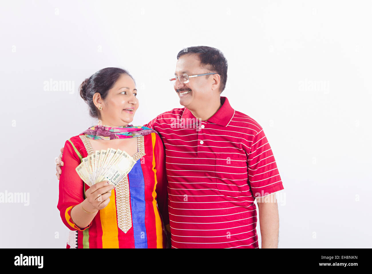 2 indian Seniors Married couples money showing Stock Photo - Alamy
