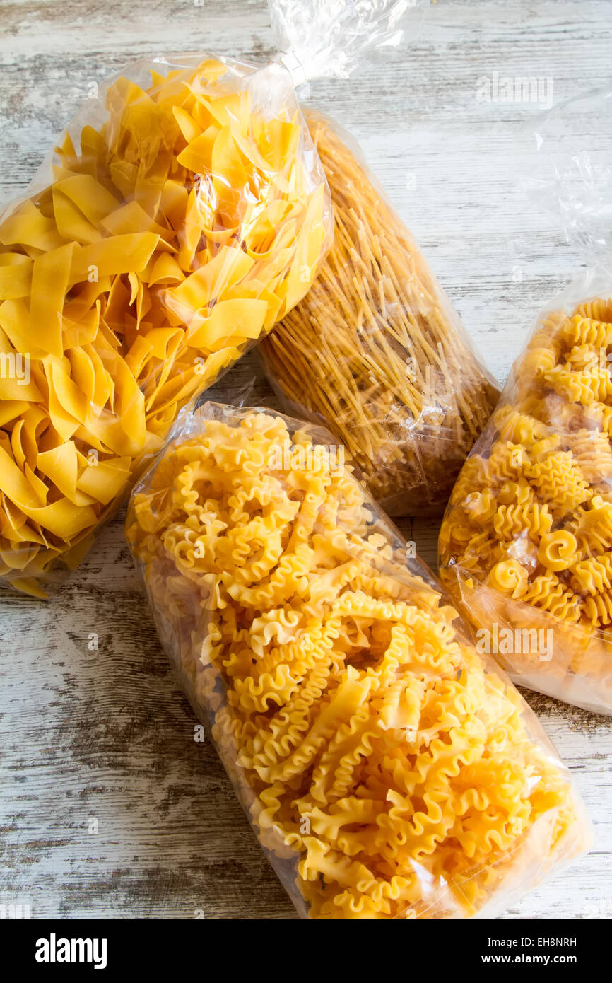 Packs of variety of egg pasta background Stock Photo