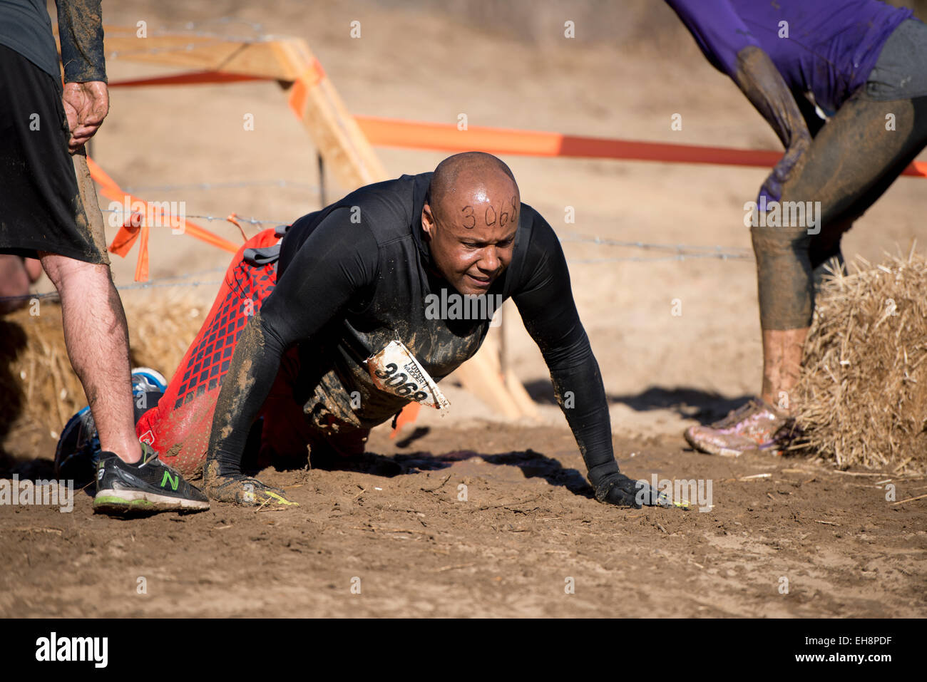 Participants compete in the Tough Mudder event, known as the premier