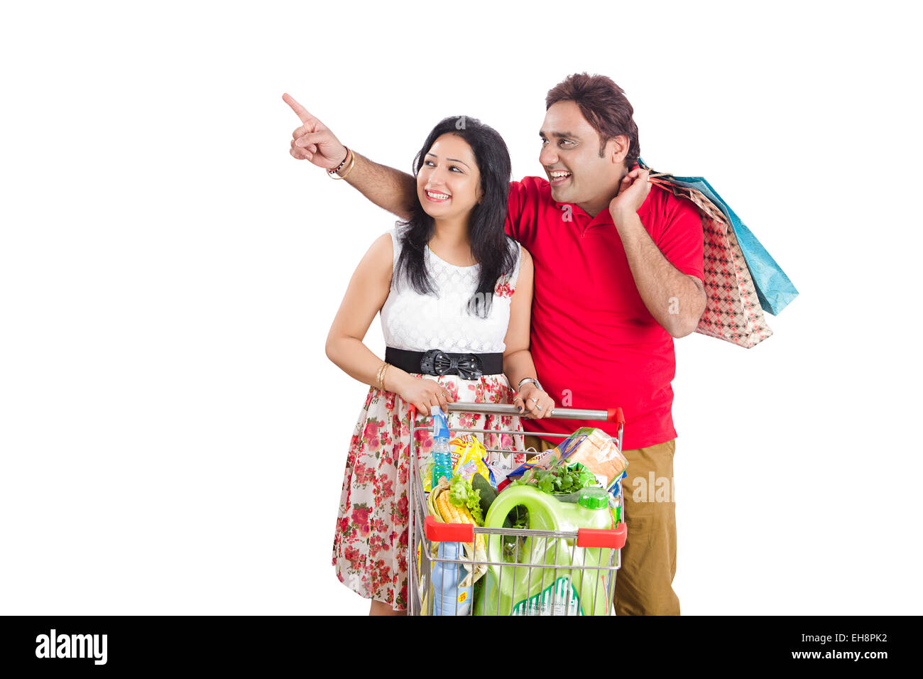 2 indian Seniors  Married couples trolley Shopping finger pointing Stock Photo