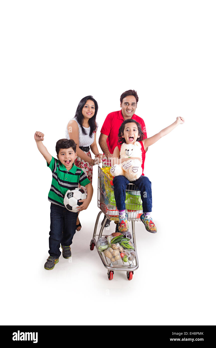 4 indian kids and Parents Trolley Shopping running Stock Photo