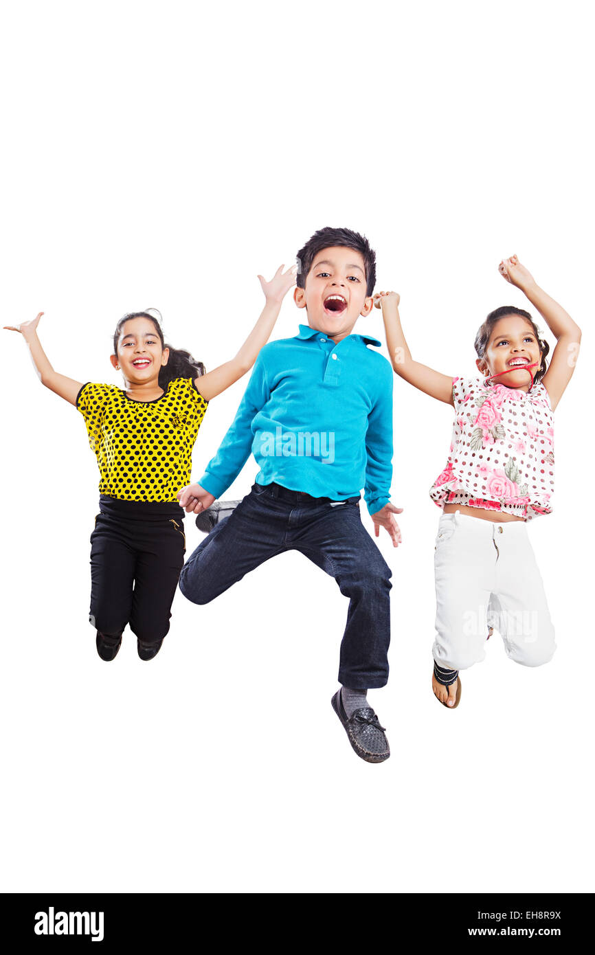3 indian kids Friends Jumping shouting fun Stock Photo