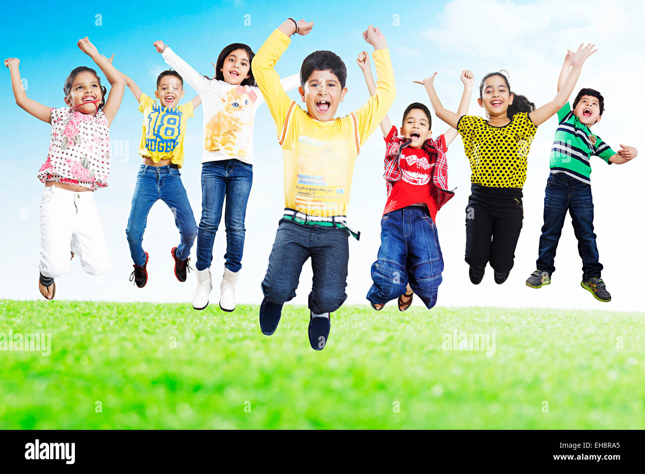 indian group crowds kids Friends park Jumping shouting fun Stock Photo
