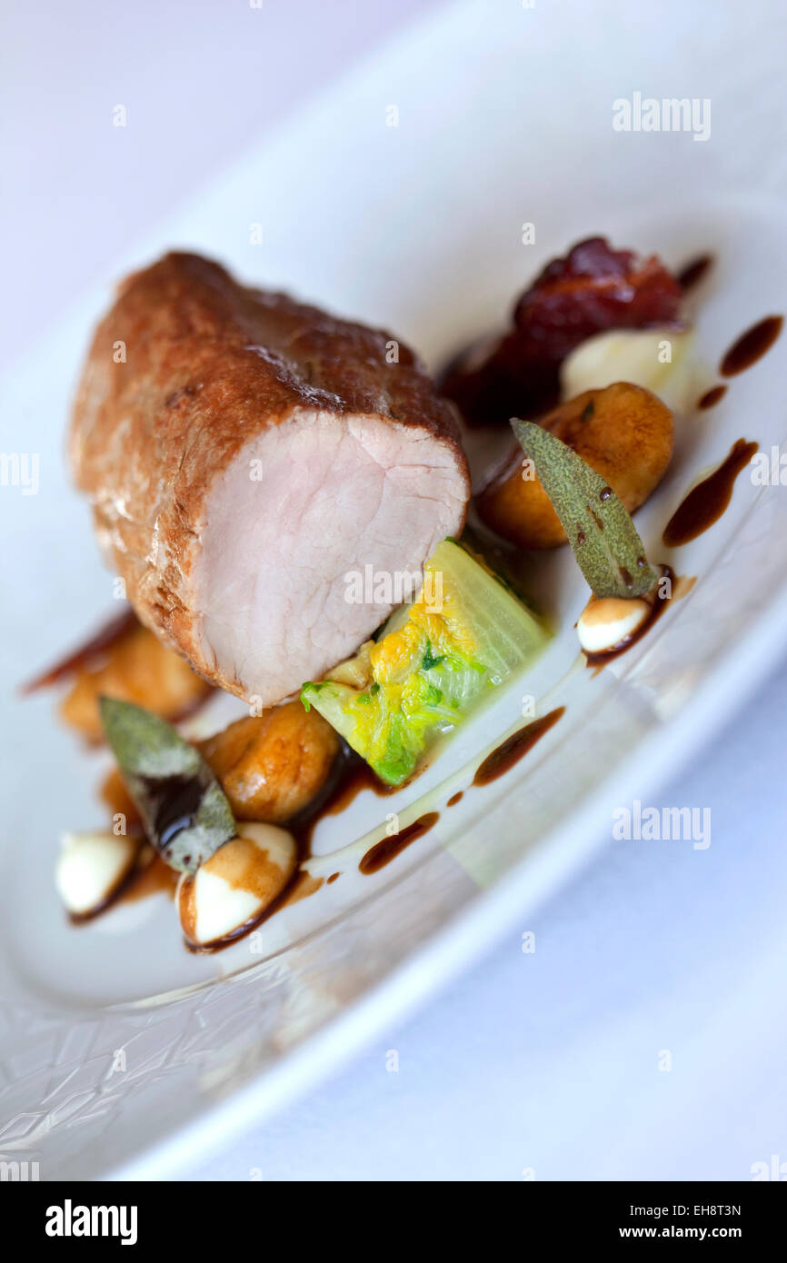 Dish with pork filet mignon, gnocchi and cabbage Stock Photo Alamy