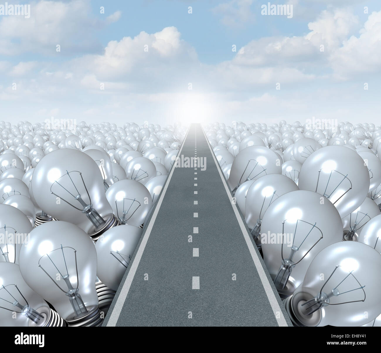 Idea road and creative Path business concept as a street or highway cutting through a landscape of light bulbs as a symbol and metaphor for innovation success and brainstorming solution. Stock Photo