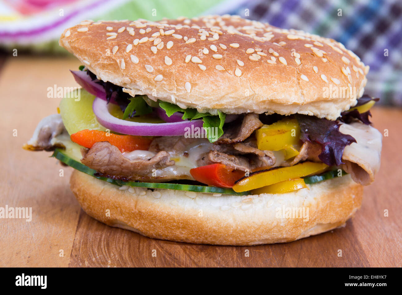 philly cheese steak burger sandwich with vegetables Stock Photo