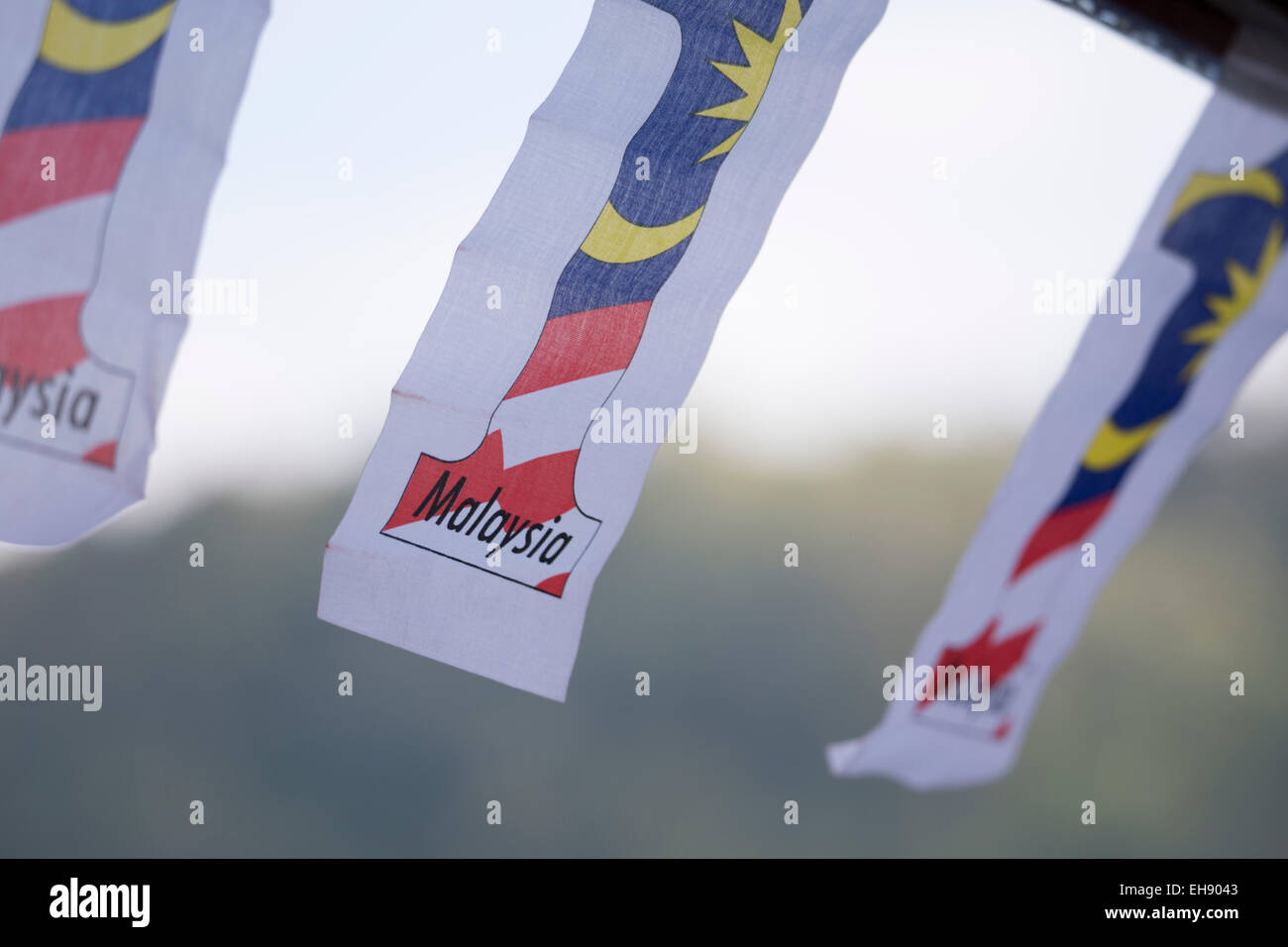 Malaysian political flags hanging from the eaves of a restaurant in Pahang Province, Malaysia Stock Photo