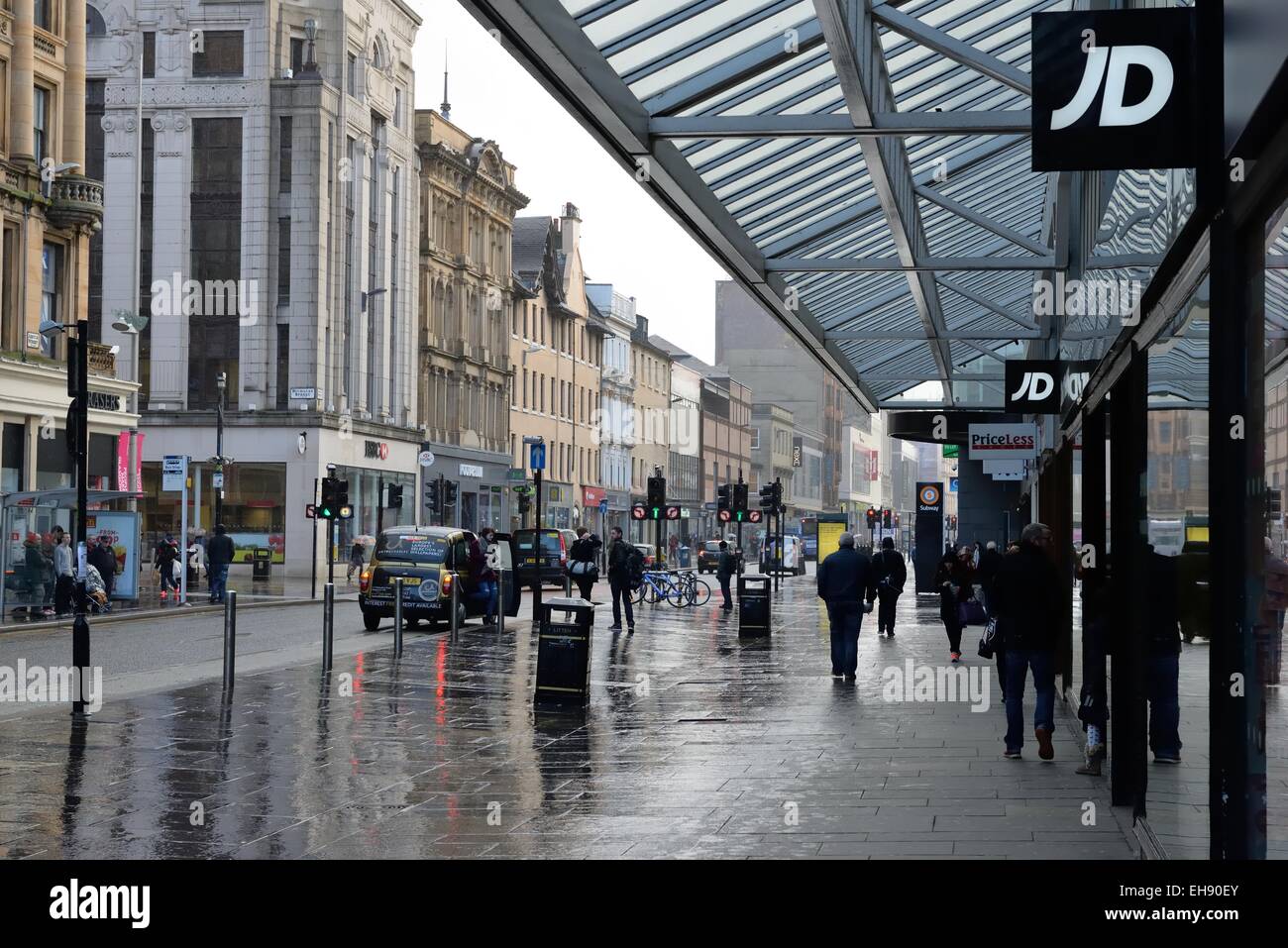 A wet rainy day outside JD sports shop on Argyle Street, Glasgow city