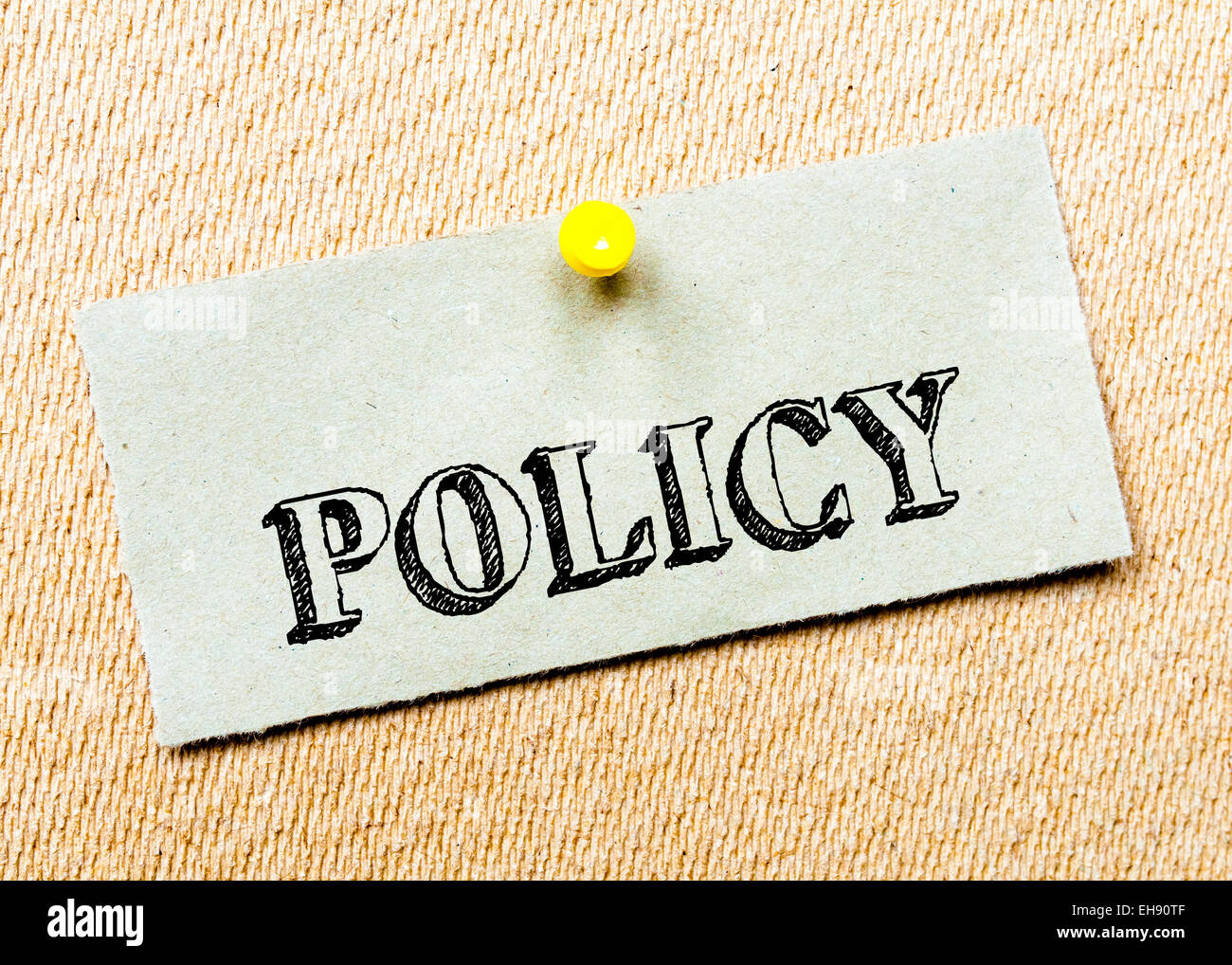 Recycled paper note pinned on cork board.Policy Message. Concept Image ...