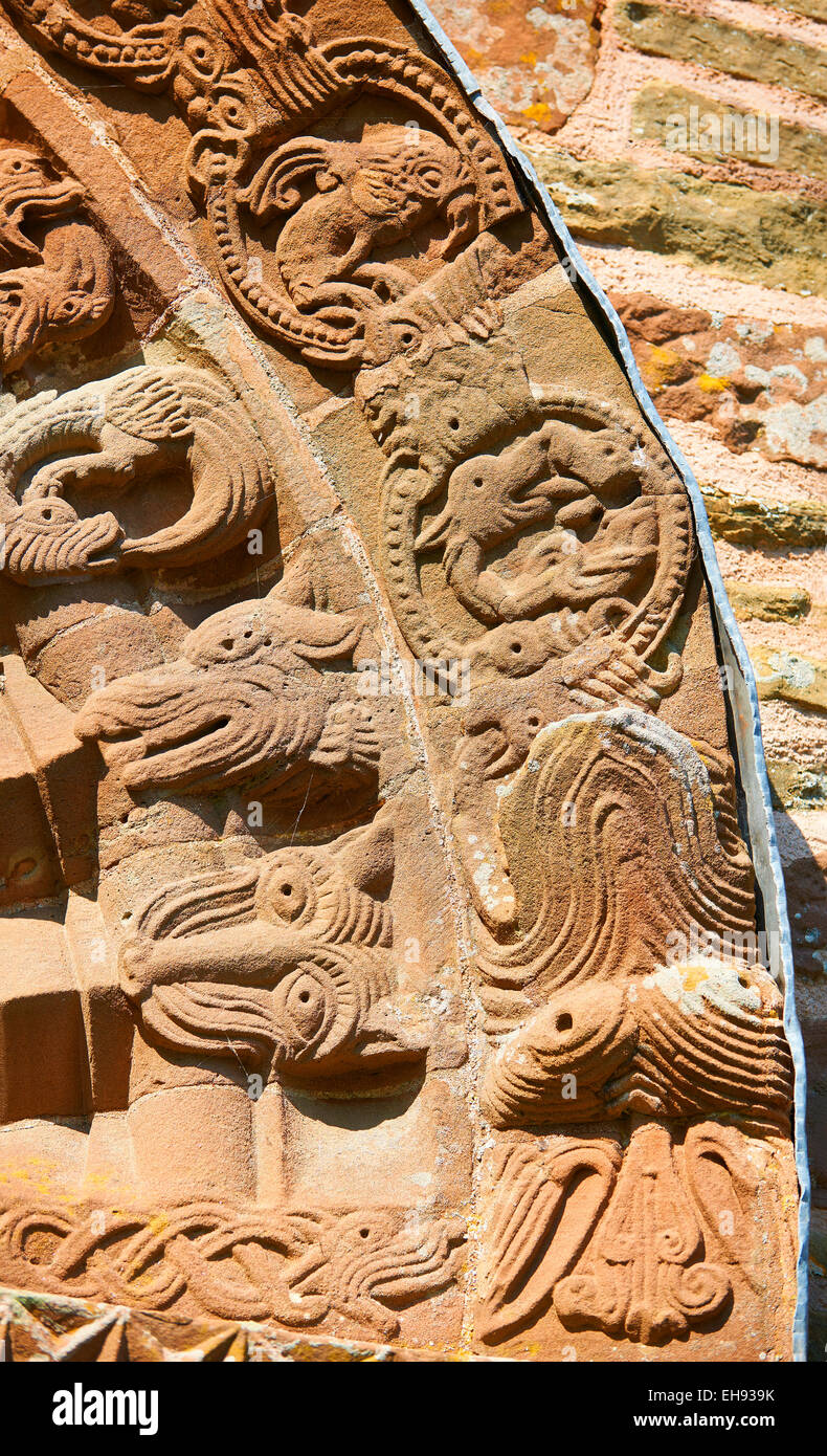 Norman Romanesque relief sculptures of dragons and mythical creatures , Kilpeck Church, Herefordshire, England Stock Photo