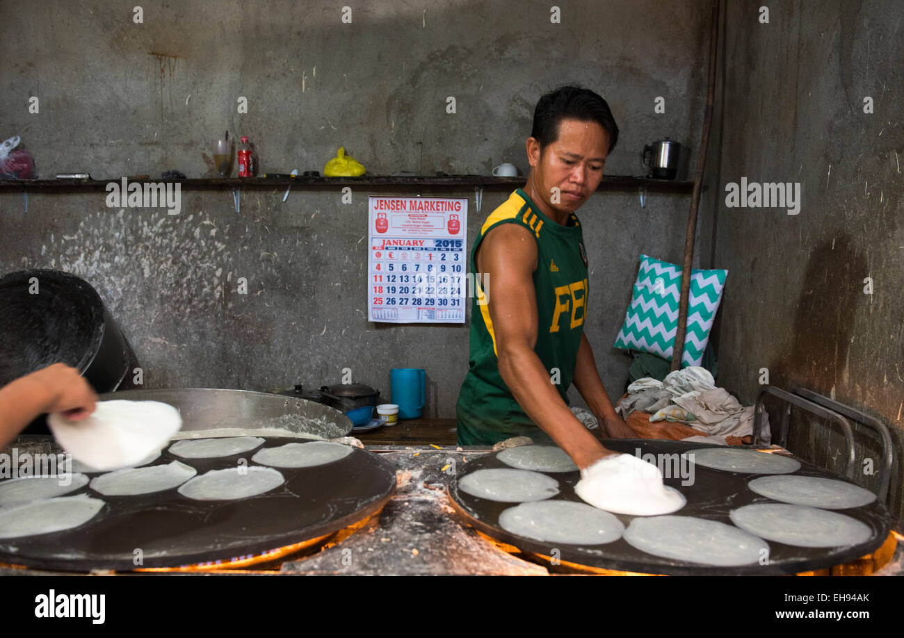 Preparing 'Spring Roll' wrappers in a small shop in the market of Kalibo, Philippines. Stock Photo