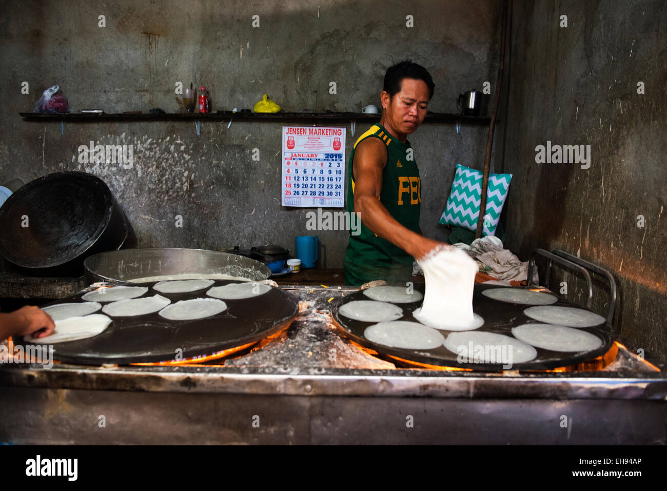 Preparing 'Spring Roll' wrappers in a small shop in the market of Kalibo, Philippines. Stock Photo
