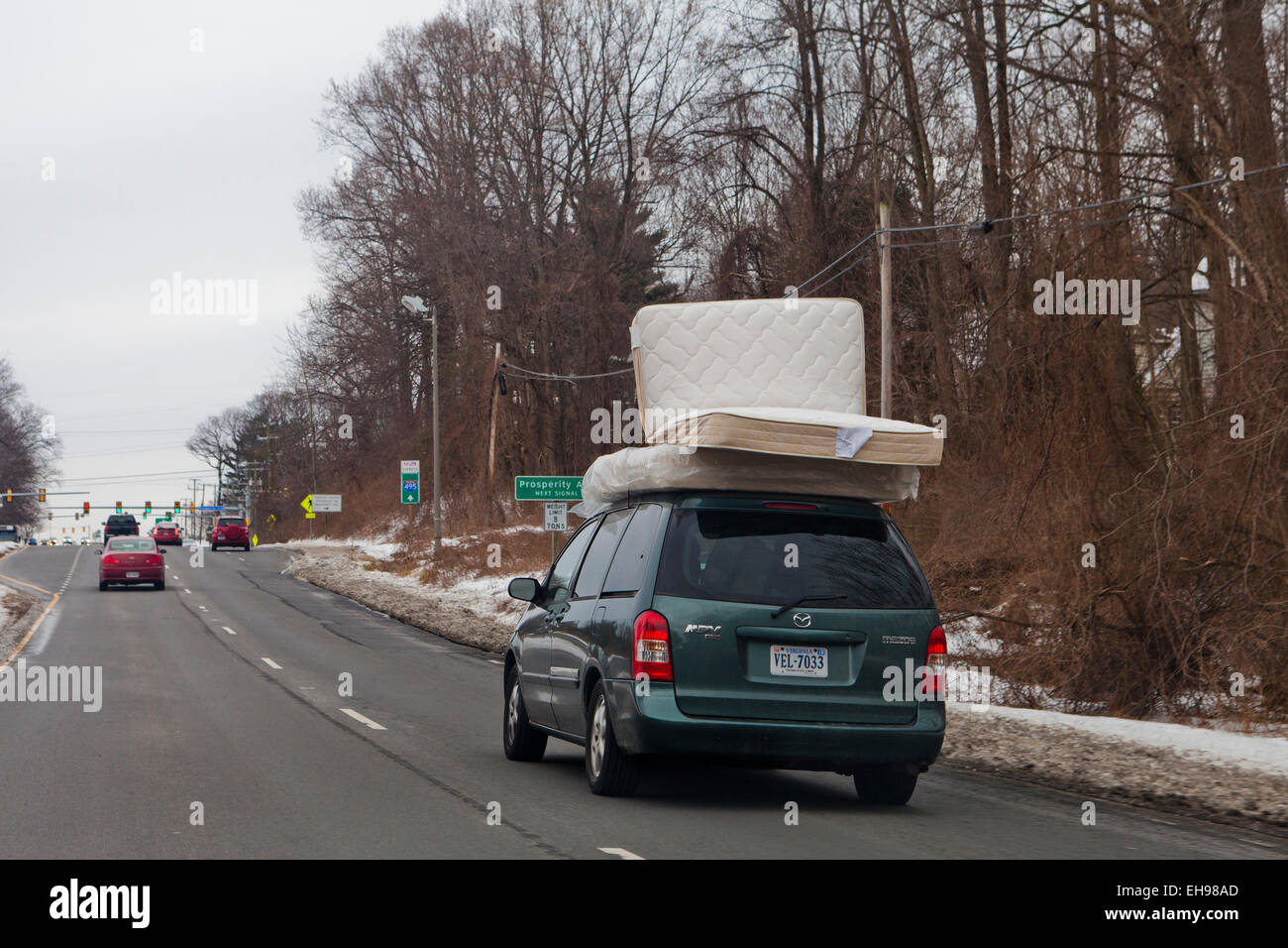 Bed mattresses on top of minivan - USA Stock Photo