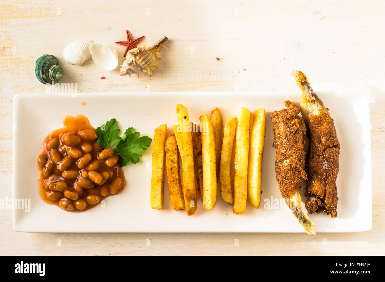 Fish and chips on a plate. Appetizer with seafood top view Stock Photo
