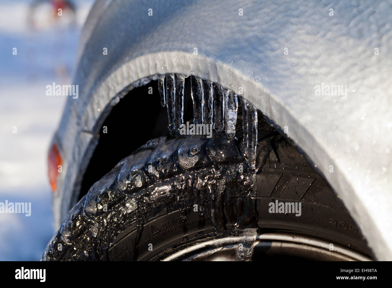 Freezing rain on car wheel - Virginia USA Stock Photo