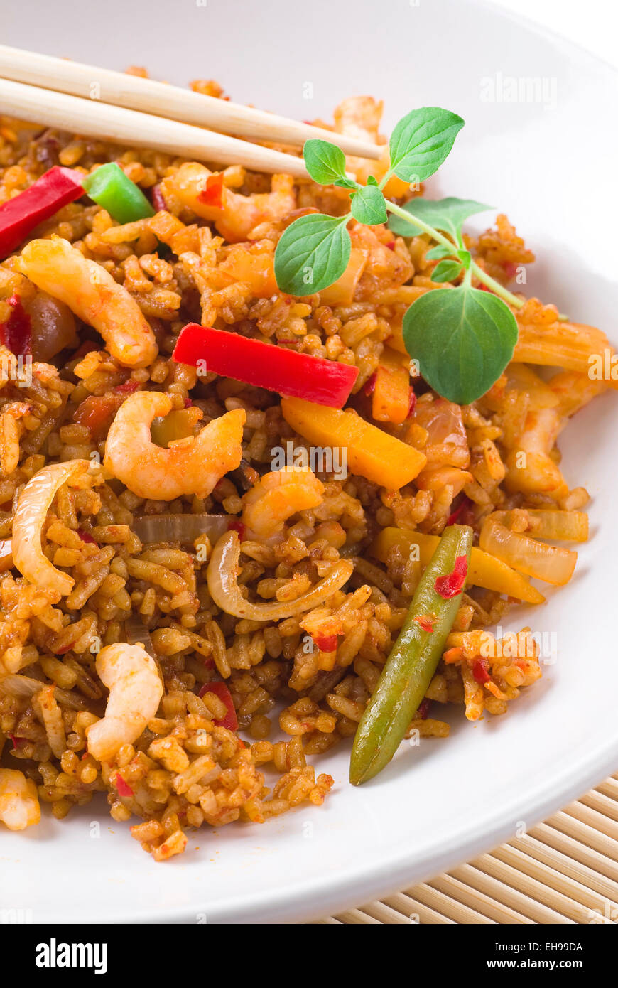Rice with spicy shrimps and vegetables. Stock Photo