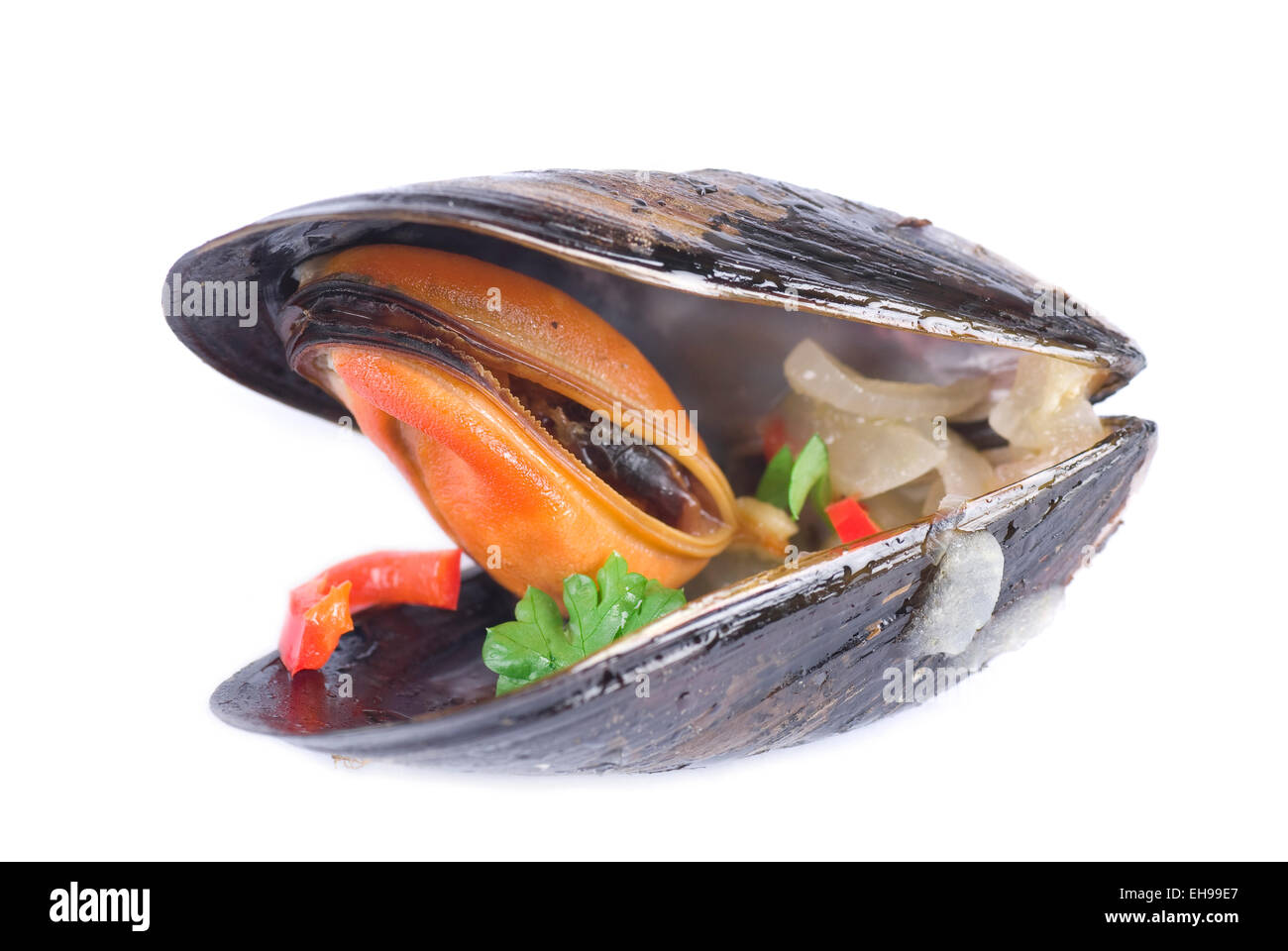 Mussel cooked with chili pepper, onion and parsley. Stock Photo