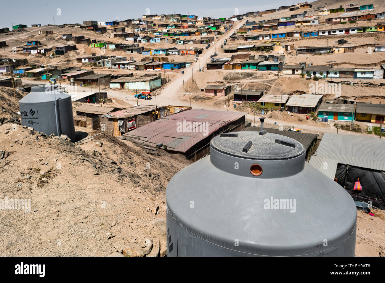 https://c8.alamy.com/comp/EH9AT8/a-large-plastic-water-tanks-used-for-water-storage-are-seen-on-the-EH9AT8.jpg