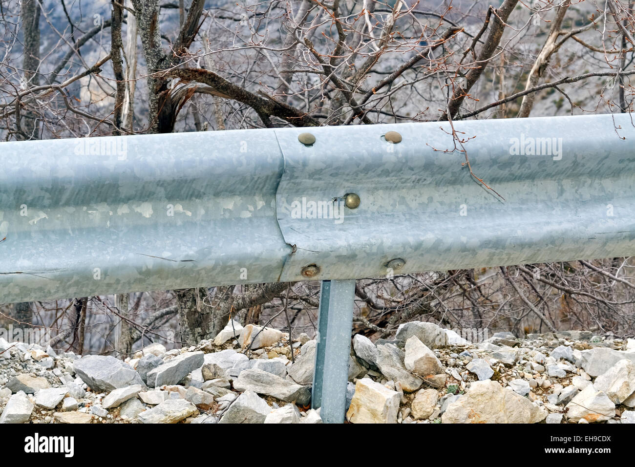 Fence on the road as prevention in case of accident Stock Photo