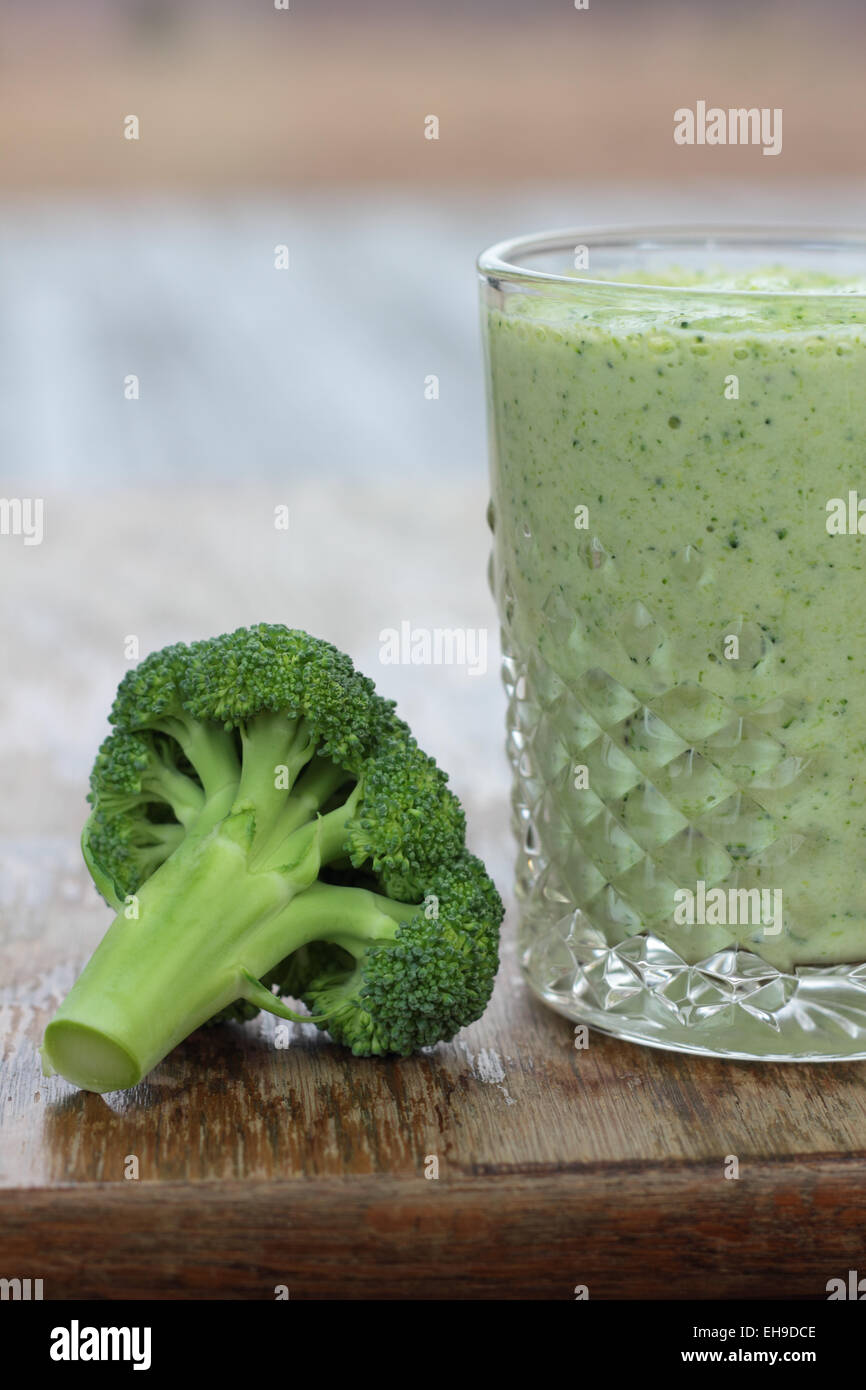 Glass full of apple, broccoli and kiwi milk smoothie Stock Photo Alamy