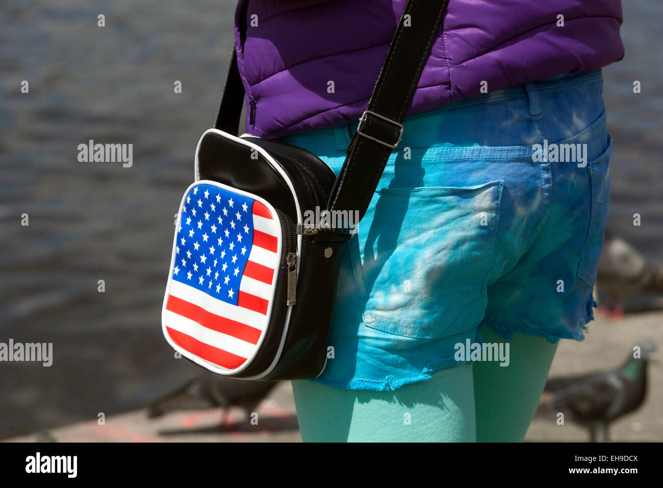 Teenage girl handbag street outfit with US flag Stock Photo