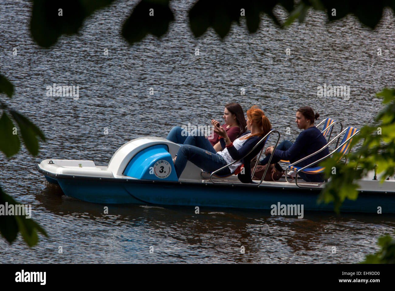 Girls on Pedal boat Vltava River trip, Prague Stock Photo