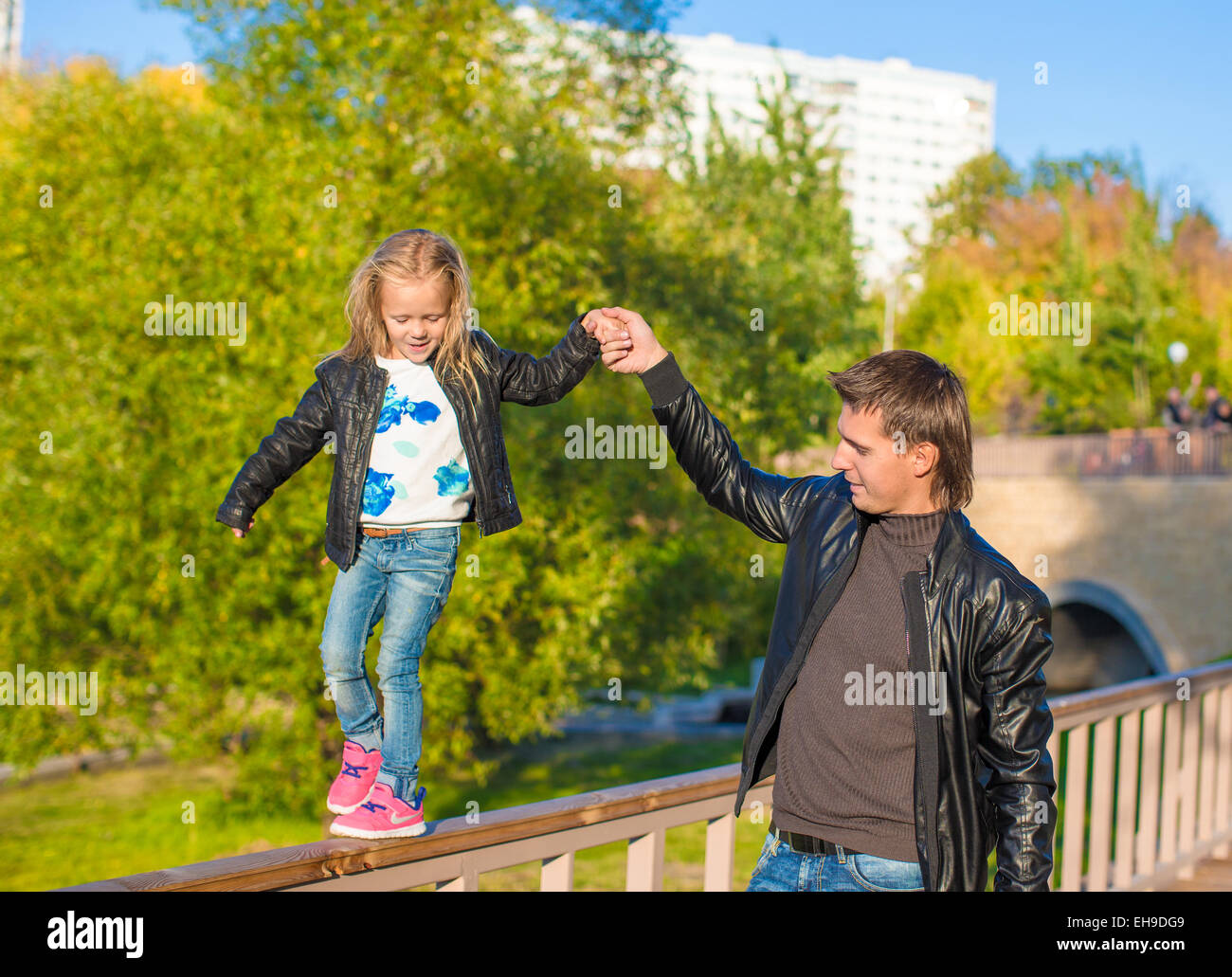 Adorable daughter and little father in autumn park outdoors Stock Photo ...