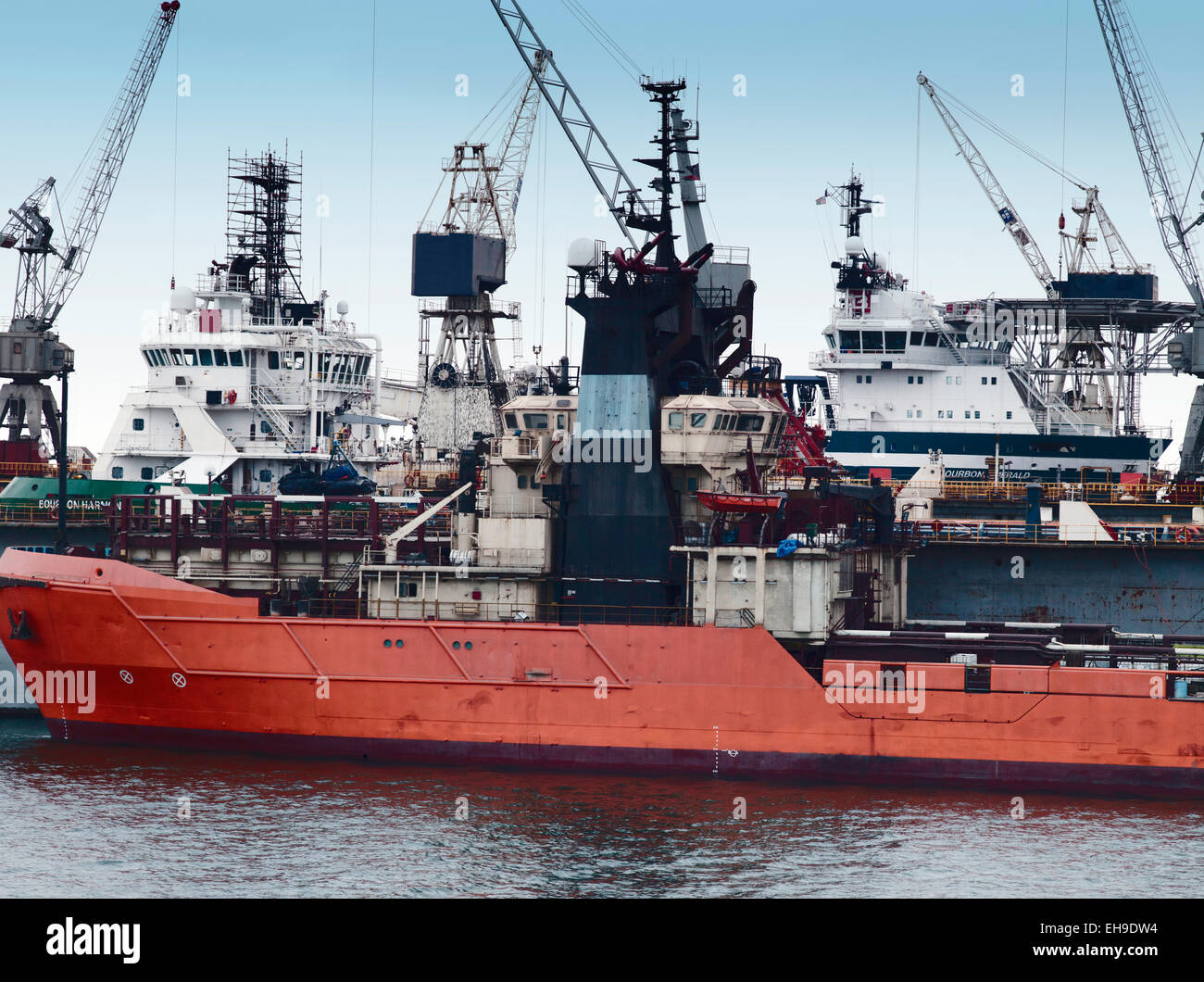 Multi purpose supply vessel at oil platform at sea hires stock