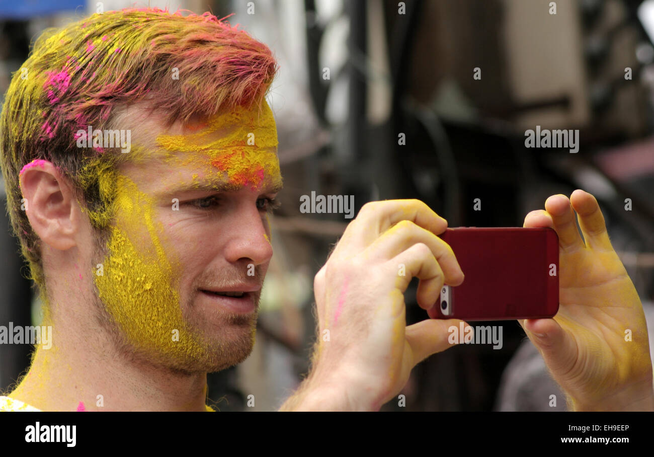 Tourist shoot Indian Hindus celebrate Holi,festival of colors,annual festival on March 6,2015 in Hyderabad,India. Stock Photo