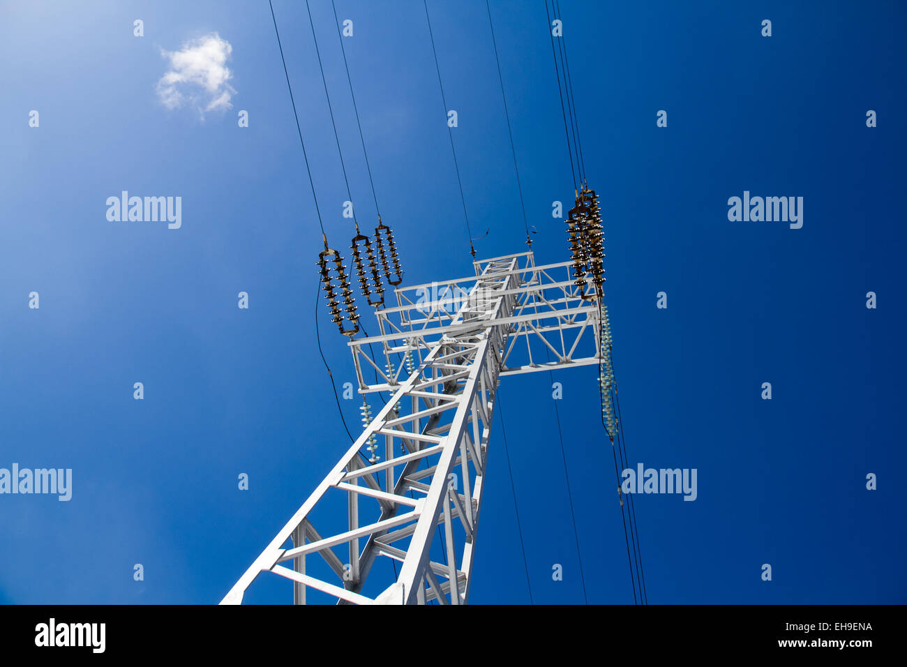 Reliance power lines against the blue sky Stock Photo