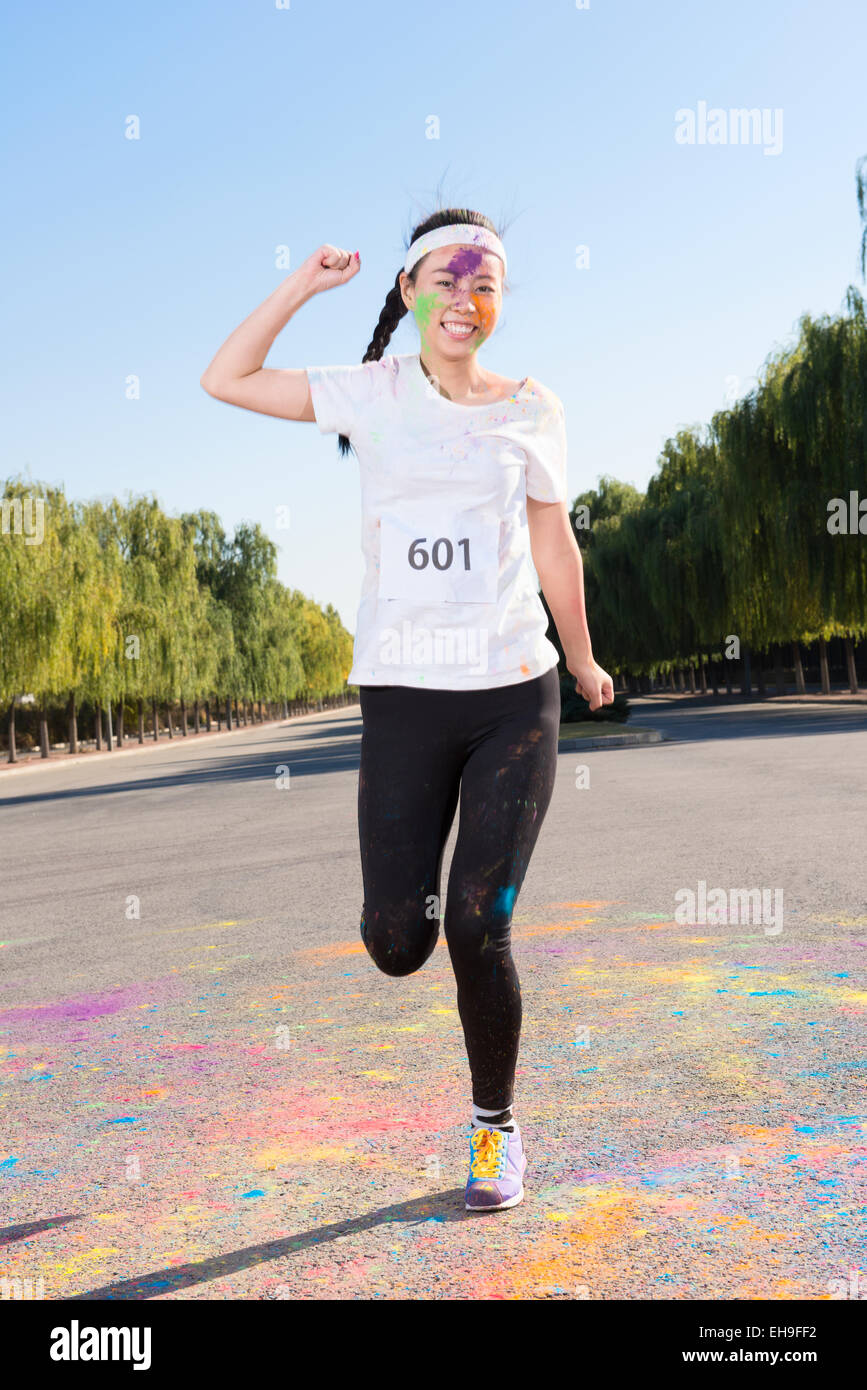Young woman at The Color Run Stock Photo - Alamy