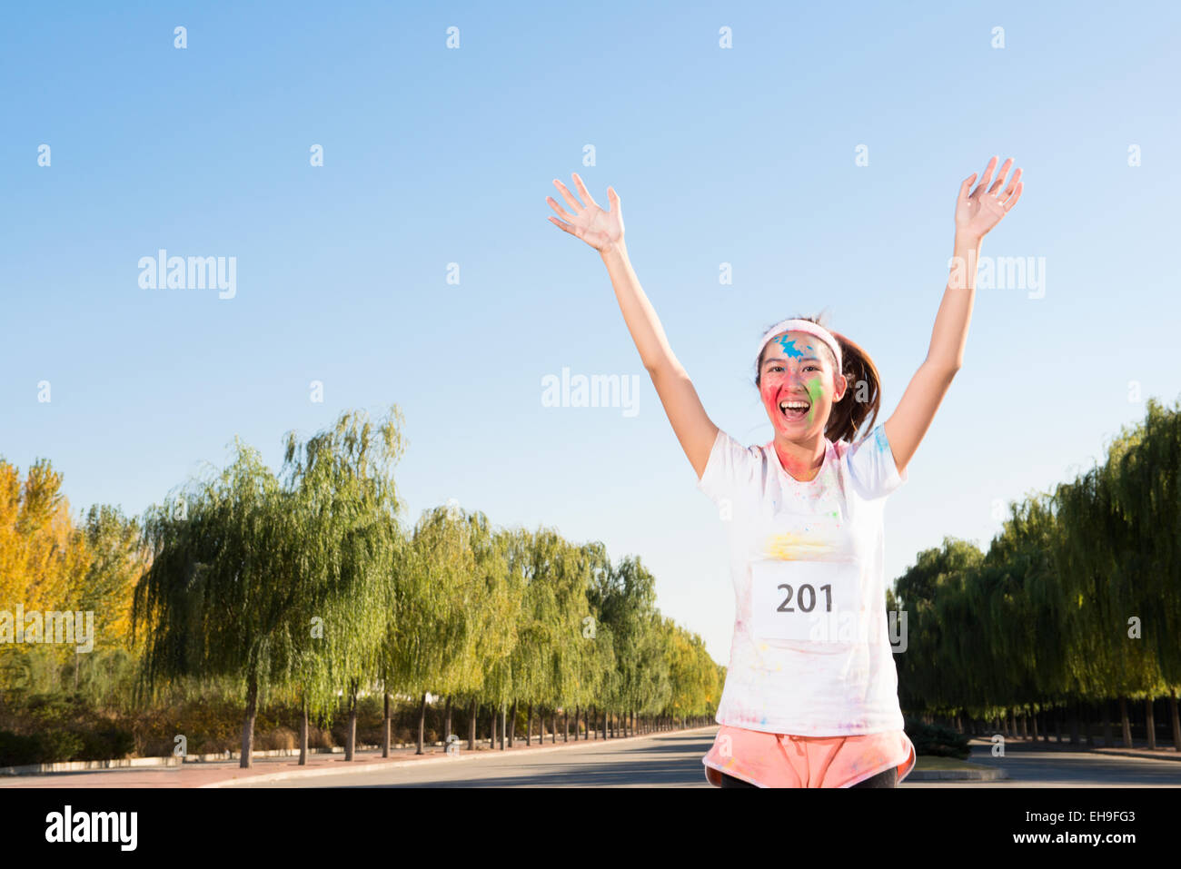 Young woman at The Color Run Stock Photo - Alamy