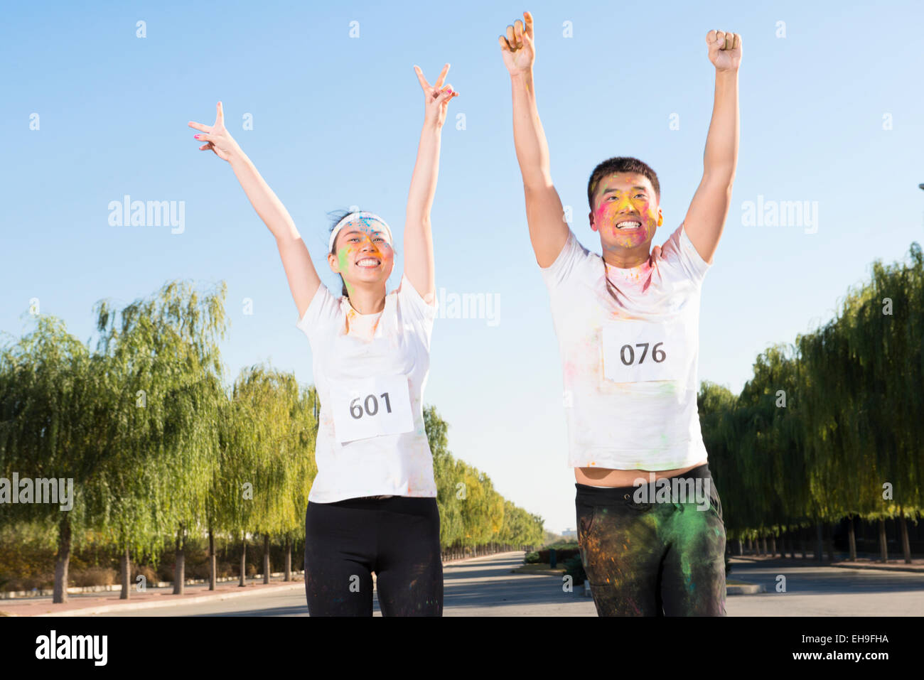 Young couple at The Color Run Stock Photo - Alamy