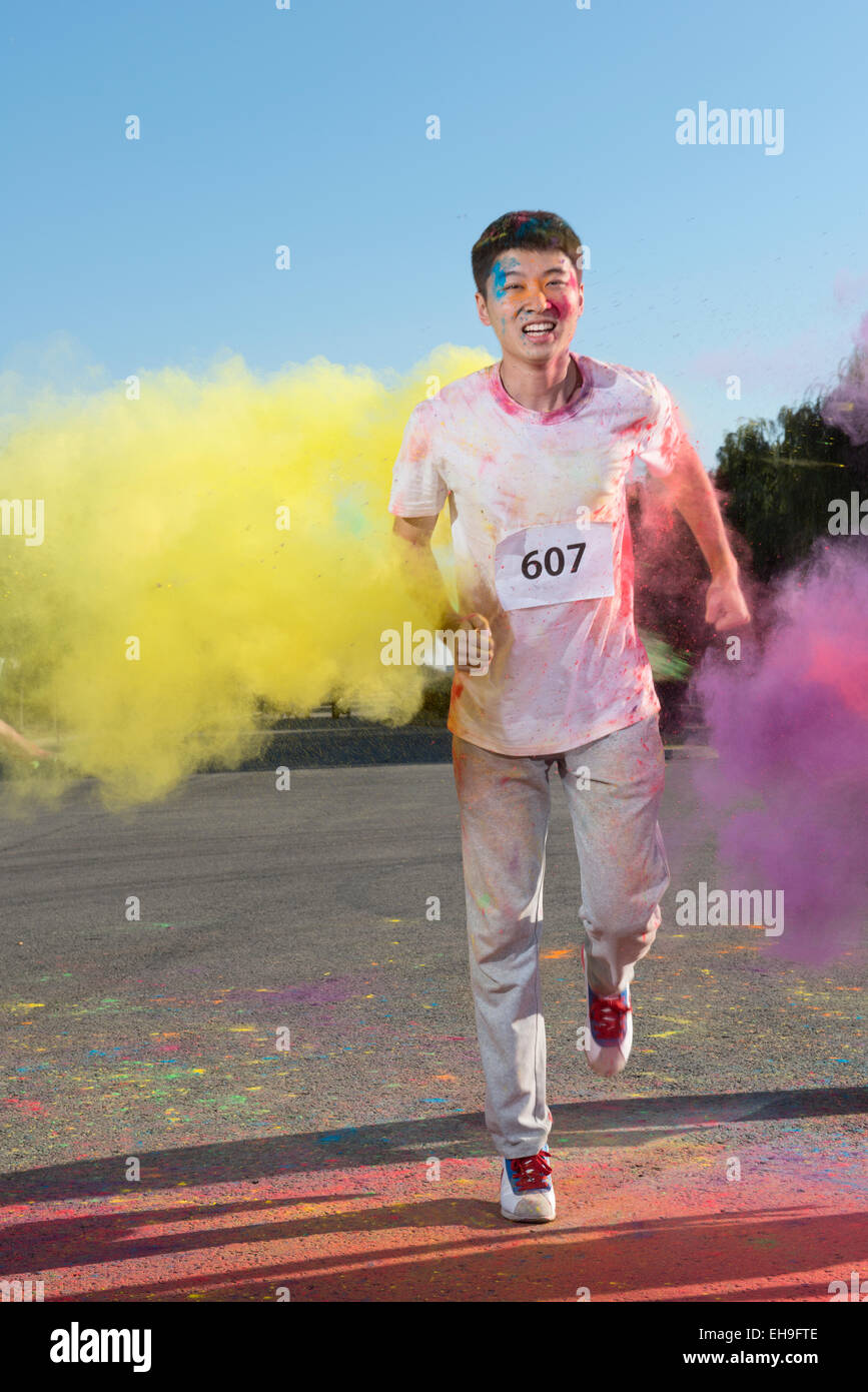 Young man at The Color Run Stock Photo - Alamy