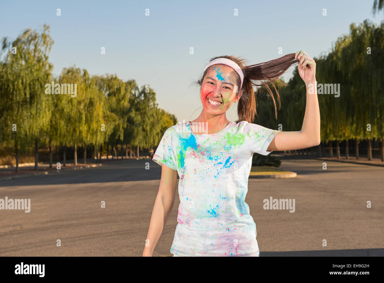 Young woman at The Color Run Stock Photo - Alamy