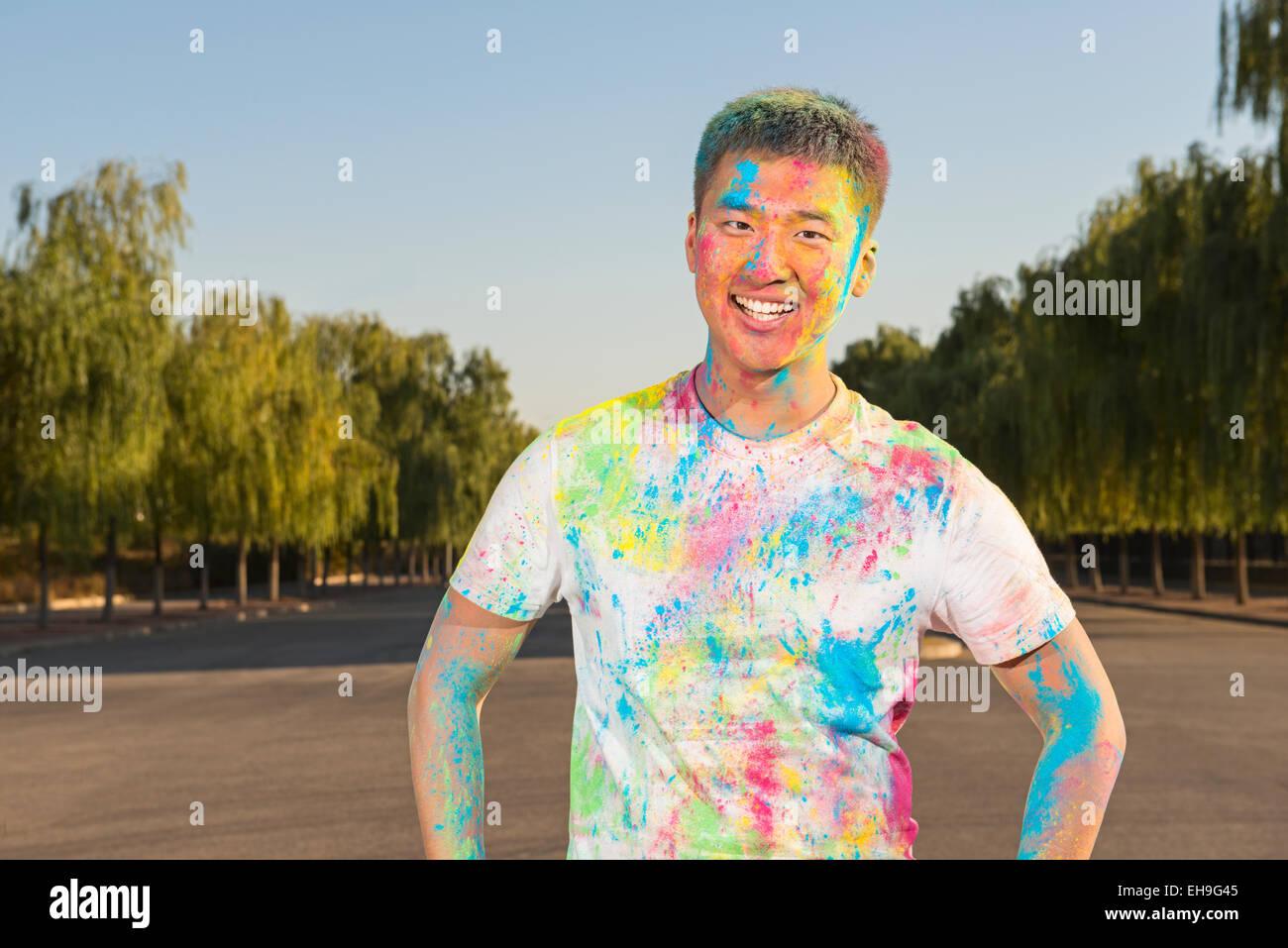 Young man at The Color Run Stock Photo - Alamy
